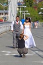 The girl takes pictures of a couple of newlyweds in Tyumen