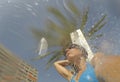 A girl takes a shower on magaluf beach in Majorca