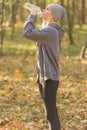 Athlete girl taking a break during run to hydrate