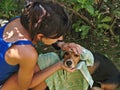 Girl drying dog after bath