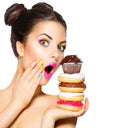 Girl taking colorful sweets and colorful donuts Royalty Free Stock Photo