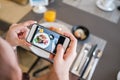 Girl taking food photo with phone camera Royalty Free Stock Photo