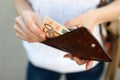 Girl is taking out fifty-euro banknote from her leather wallet Royalty Free Stock Photo