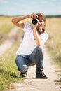 Girl taking photo with camera Royalty Free Stock Photo