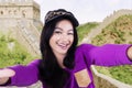 Girl taking photo at Great Wall of China Royalty Free Stock Photo