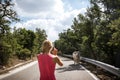 Girl taking photo of white bull on the street