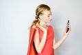 Girl taking picture of herself in a new dress. The concept of fashion shopping. Royalty Free Stock Photo