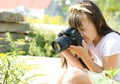 Girl taking picture on natural, uotdoor Royalty Free Stock Photo