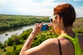 The girl is taking pictures on the phone. Royalty Free Stock Photo