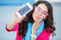 Girl taking pictures of yourself on your cell phone Royalty Free Stock Photo