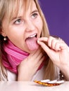 Girl is taking a pill Royalty Free Stock Photo