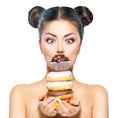 Girl taking stack of colorful donuts and muffin