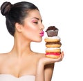 Girl taking sweets and colorful donuts Royalty Free Stock Photo