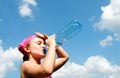 Girl taking a thirsty drink