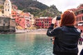 Girl is taking a video of Vernazza village Royalty Free Stock Photo