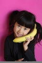 Girl talking on a Banana