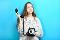 Girl is talking on an old wire phone Royalty Free Stock Photo