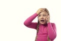 The girl is talking on the phone. Beautiful excited surprised little girl having conversation with friends mobile phone Royalty Free Stock Photo