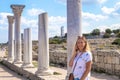 Girl talking on the phone near the columns Royalty Free Stock Photo