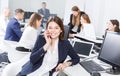 girl talking on phone in office Royalty Free Stock Photo