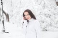 Girl talking on the phone outdoors in winter. Royalty Free Stock Photo