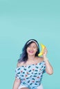 Girl talkings with a banana. Yellow makeup. Fun Royalty Free Stock Photo