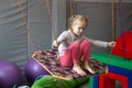 Girl in tape made of elastic material. sensory experience, enhance tactile and sensitivity Royalty Free Stock Photo