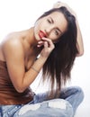 Girl with tattered jeans sit on floor Royalty Free Stock Photo