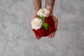 Girl with a tattoo on her hands holding a bouquet of flowers Royalty Free Stock Photo