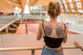Girl with tattoo visiting China pavilion at Expo 2015 in Milan,