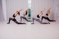 Girl teaches Yoga young in the Studio