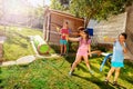 Girl with group of kids play water gun fight Royalty Free Stock Photo