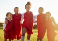 Girl team, kids group portrait on soccer field and happy girls together. Teamwork, football and diversity, proud female Royalty Free Stock Photo