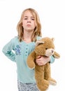 Angry girl in pajamas with teddybear