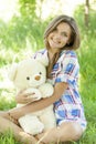 Girl with Teddy bear in the park Royalty Free Stock Photo
