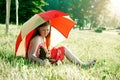 Girl with teddy bear under summer umbrella Royalty Free Stock Photo