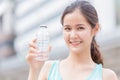 Girl teen drinking water happy smile holding plastic bottle Royalty Free Stock Photo