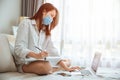 Girl teen education or working at home during covid self quarantine, ware face mask learning online