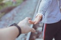 Girl teen reach her hand to touch and holding together