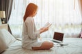 Girl teen read a book self education or working at home during covid self quarantine. women reading a book at bed in the morning