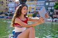 Girl teen with skateboard and tablet selfie Royalty Free Stock Photo