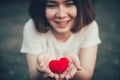 Girl teen smile with red heart in hand for giving help donation medical healthcare concept Royalty Free Stock Photo