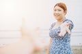 Girl teen smiling and reach her hand and looking together. Help Touch Care Support be a Good Friend with Love concept Royalty Free Stock Photo