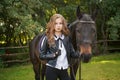 Girl teenager with a horse Royalty Free Stock Photo