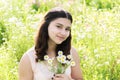 Girl teenager with bouquet of daisies on summer meadow Royalty Free Stock Photo