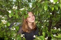 The girl teenager among foliage of a pear Royalty Free Stock Photo