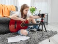 Girl teenager with guitar recording streaning with camera Royalty Free Stock Photo