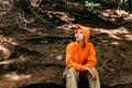 Portrait of a teenage girl in a hoodie on a natural background