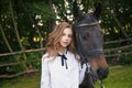 Girl teenager with a horse Royalty Free Stock Photo