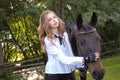 Girl teenager with a horse Royalty Free Stock Photo